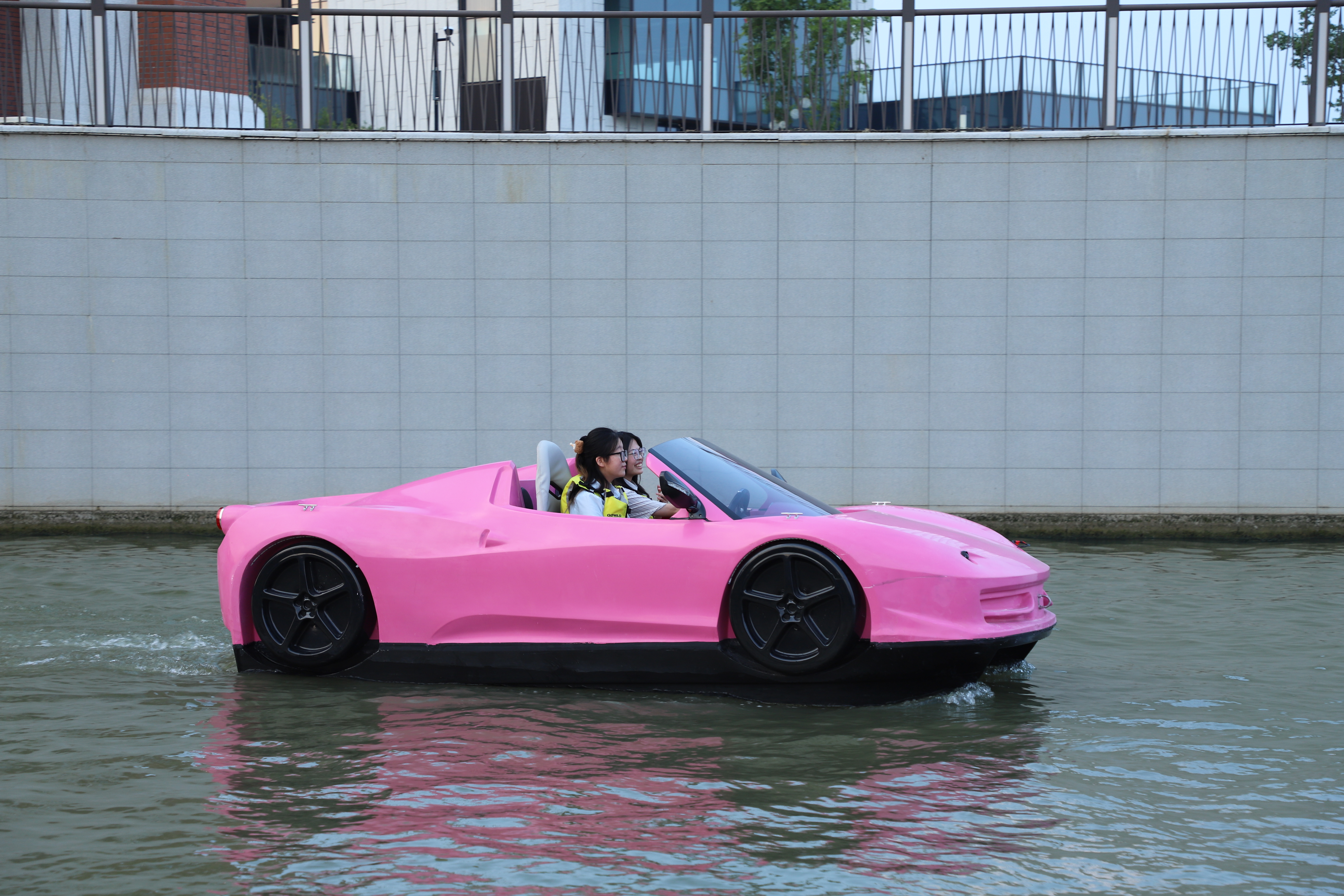 Pink water supercar driving on water